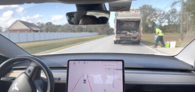 Watch Tesla Full Self-Driving Beta hesitate to pass a garbage truck almost like a human